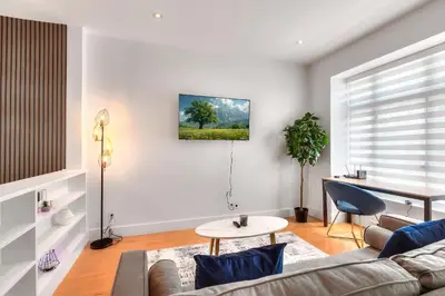 a living room with a couch and a table at Take a break in a modern loft on Plateau-Mont-Royal in Montréal