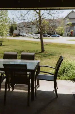 a table and chairs sitting next to a park at Etoile bleue Beach bike shops Magog-Orford in Magog-Orford