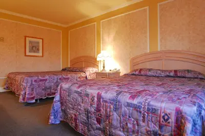 a hotel room with two beds in a room at Hôtel Travelodge by Wyndham Victoriaville in Victoriaville