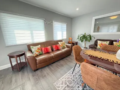 a living room with a couch and a table at Feels like a Home ,Away from Home ! in Montréal