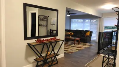a living room with a mirror on the wall at Feels like a Home ,Away from Home ! in Montréal