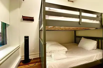 a bedroom with two bunk beds and a window at Galeria St Denis in Prime Montreal in Montréal