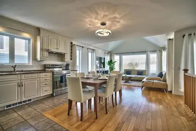 a kitchen and dining room with a table and chairs at Dynamite 2-Bedroom House, Garage, Sleeps 6 in Sherbrooke