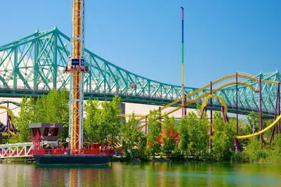 a roller coaster in the water with a bridge in the background at Beautiful & New! Renovated for your Style Comfort in Montréal