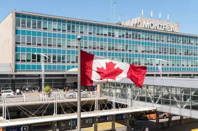 a canadian flag flying in front of a building at Beautiful & New! Renovated for your Style Comfort in Montréal