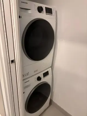 two microwaves stacked on top of each other at Beautiful & New! Renovated for your Style Comfort in Montréal
