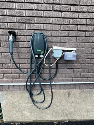 a black cord plugged into a brick wall at 10 minutes to DT with Free parking in Longueuil