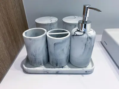 a shelf with three cups and a bottle on it at 10 minutes to DT with Free parking in Longueuil