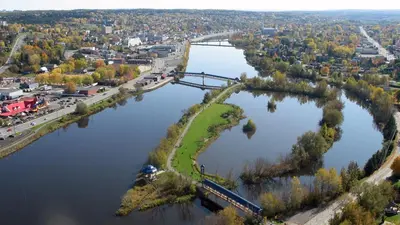an aerial view of a bridge over a river at La Suite Centre-ville Saint-Georges in Saint-Georges