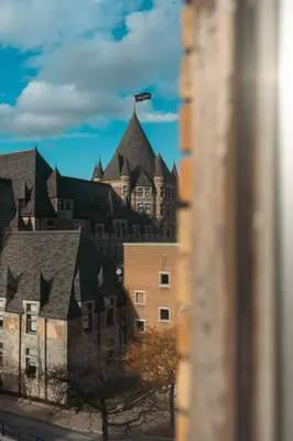 a building with a flag on the top of it at Lift Hotel in Montréal