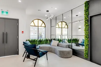a living room with a couch and chairs at Lift Hotel in Montréal