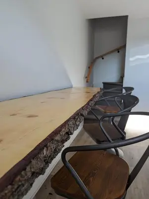 a room with a wooden table and chairs at 4 bedrooms New House in Farnham