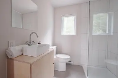a bathroom with a sink and a toilet and a shower at Chalet 2 OST Shefford in Shefford