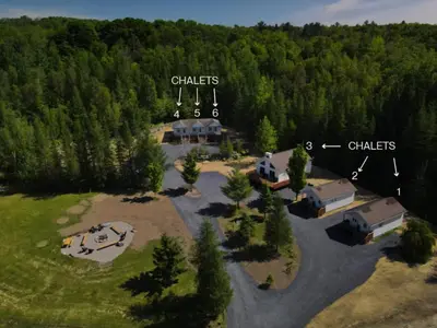 an aerial view of a campground in the middle of a forest at Chalet 2 OST Shefford in Shefford