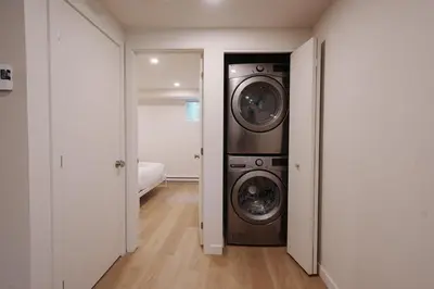 a laundry room with a washer and dryer at Chalet 4 OST Shefford in Shefford