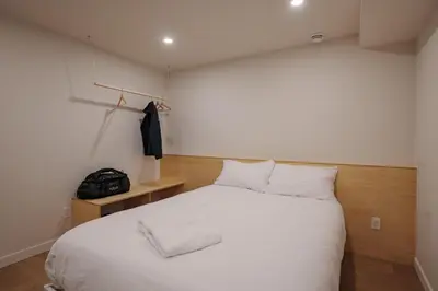 a bedroom with a large white bed with white pillows at Chalet 4 OST Shefford in Shefford