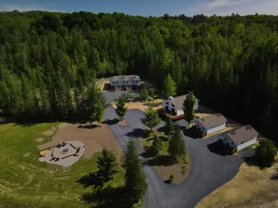 an aerial view of a house in the woods at Chalet 5 OST Shefford in Shefford