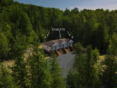 an aerial view of a house in the woods at Chalet 5 OST Shefford in Shefford