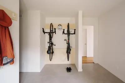 a room with bikes hanging on a wall at Chalet 3 OST Shefford in Shefford