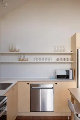 a kitchen with a stainless steel appliance in it at Chalet 3 OST Shefford in Shefford