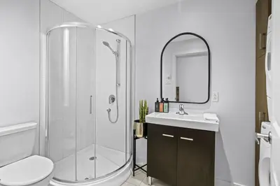 a bathroom with a shower and a toilet and a sink at Trendy Open-Space Studio by Jean Talon Market in Montréal