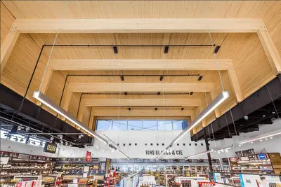 a view of a store with a large wooden ceiling at Stylish 2 Bedroom Haven by Jean Talon Market in Montréal