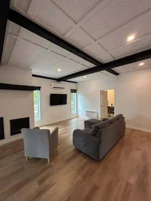 a living room with a couch and two chairs at L'Escapade - magnifique appartement in Granby