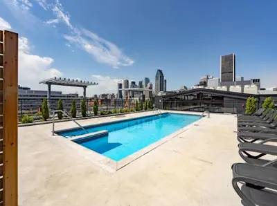 a swimming pool on the roof of a building at Penthouse with pool and parking in Montréal