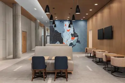 a conference room with chairs and a map on the wall at Holiday Inn Express Montreal Airport - St-Laurent by IHG in Montréal