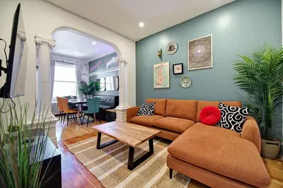 a living room with a couch and a table at MTLVacationRentals- Le Clebard in Montréal