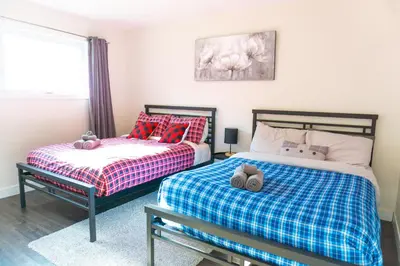 two beds sitting next to each other in a bedroom at Archimede Panorama Spa in Austin