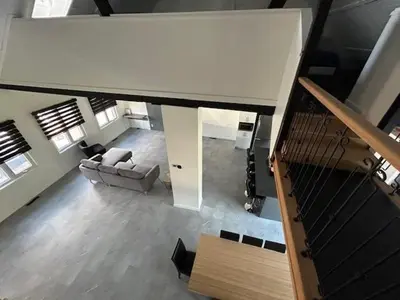 an overhead view of a living room with a staircase at La Mezzanine in Granby
