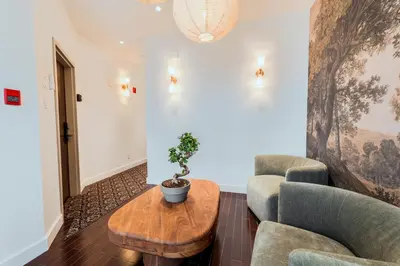 a living room with two chairs and a table at Self Check-In Boutique Hotel - Quartier latin - Room 101 in Montréal