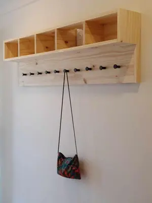 a bag hanging from a shelf on a wall at Chalet Aventure Orford in Orford