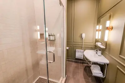 a bathroom with a shower and a sink at Self Check-In Boutique Hotel - Quartier latin - Room 102 in Montréal