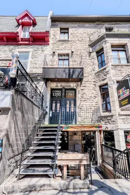 a building with stairs and a bench in front of it at Self Check-In Boutique Hotel - Quartier latin - Room 103 in Montréal