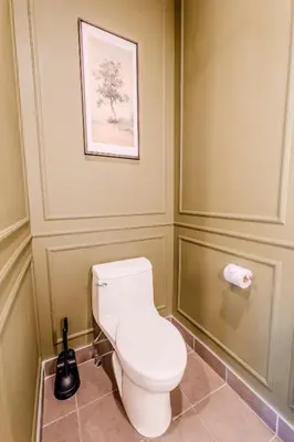 a bathroom with a toilet and a picture on the wall at Self Check-In Boutique Hotel - Quartier latin - Room 201 in Montréal