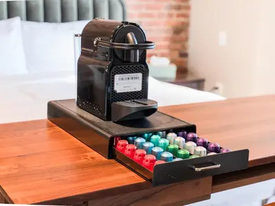 a iron sitting on a table with a box of chools at Self Check-In Boutique Hotel - Quartier latin - Room 201 in Montréal