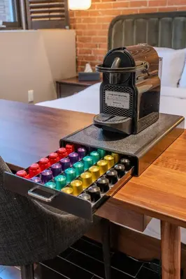 a table with a box ofools on a table at Self Check-In Boutique Hotel - Quartier latin - Room 202 in Montréal