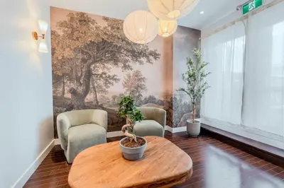 a living room with a table and two chairs at Self Check-In Boutique Hotel - Quartier latin - Room 203 in Montréal
