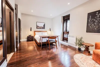 a bedroom with a bed and a table in a room at Self Check-In Boutique Hotel - Quartier latin - Room 301 in Montréal