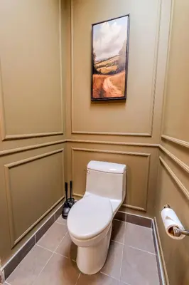 a bathroom with a toilet and a painting on the wall at Self Check-In Boutique Hotel - Quartier latin - Room 302 in Montréal