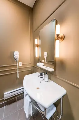 a bathroom with a sink and a mirror at Self Check-In Boutique Hotel - Quartier latin - Room 302 in Montréal