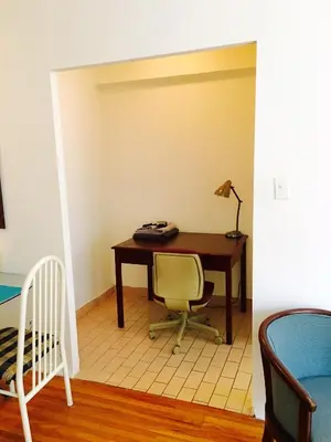 an office with a desk and a chair and a lamp at Stylish Montreal Apartment Comfortable Stay in the Golden Square Mile in Montréal