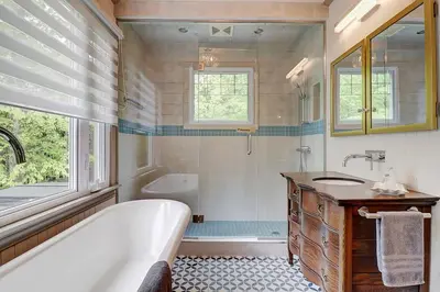 a bathroom with a tub and a shower and a sink at View and access to Lake Orford - Spa - Australe in Austin