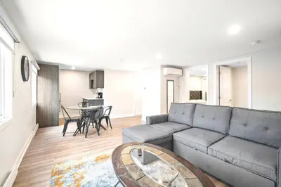 a living room with a couch and a table at Fancy 3 BDR in Heart of Plateau B in Montréal