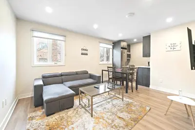 a living room with a couch and a table at Fancy 3 BDR in Heart of Plateau B in Montréal
