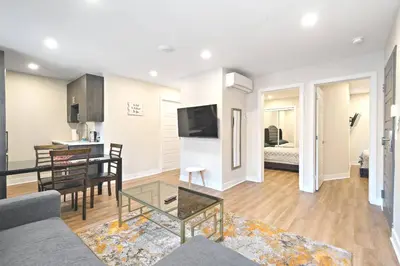 a living room with a couch and a table at Fancy 3 BDR in Heart of Plateau B in Montréal
