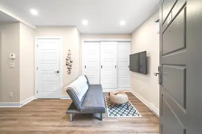 a living room with a table and a chair at Elegant 1BDR in Heart Of Plateau B in Montréal