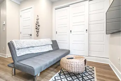 a living room with a couch and a table at Elegant 1BDR in Heart Of Plateau B in Montréal